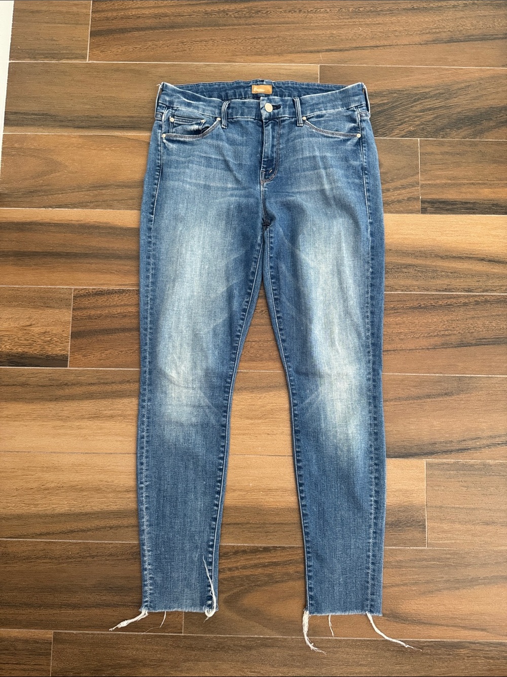 MOTHER Women's Skinny Jeans in Medium Blue Wash. Style is the Looker Ankle Fray